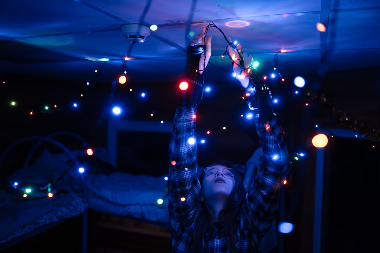 Anna Romashchuk, 13, who lost her parents in a Russian strike, decorates her room with ornaments