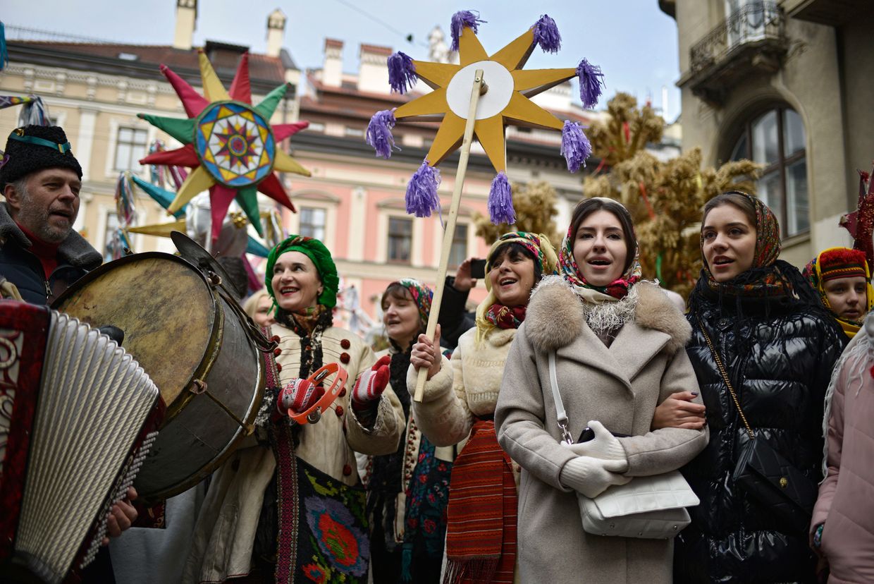 People in traditional clothes take to the streets as part of the Parade of Zvizdars during the Flash of the Christmas Star Festival, Lviv, Ukraine, on Jan. 8, 2022. 