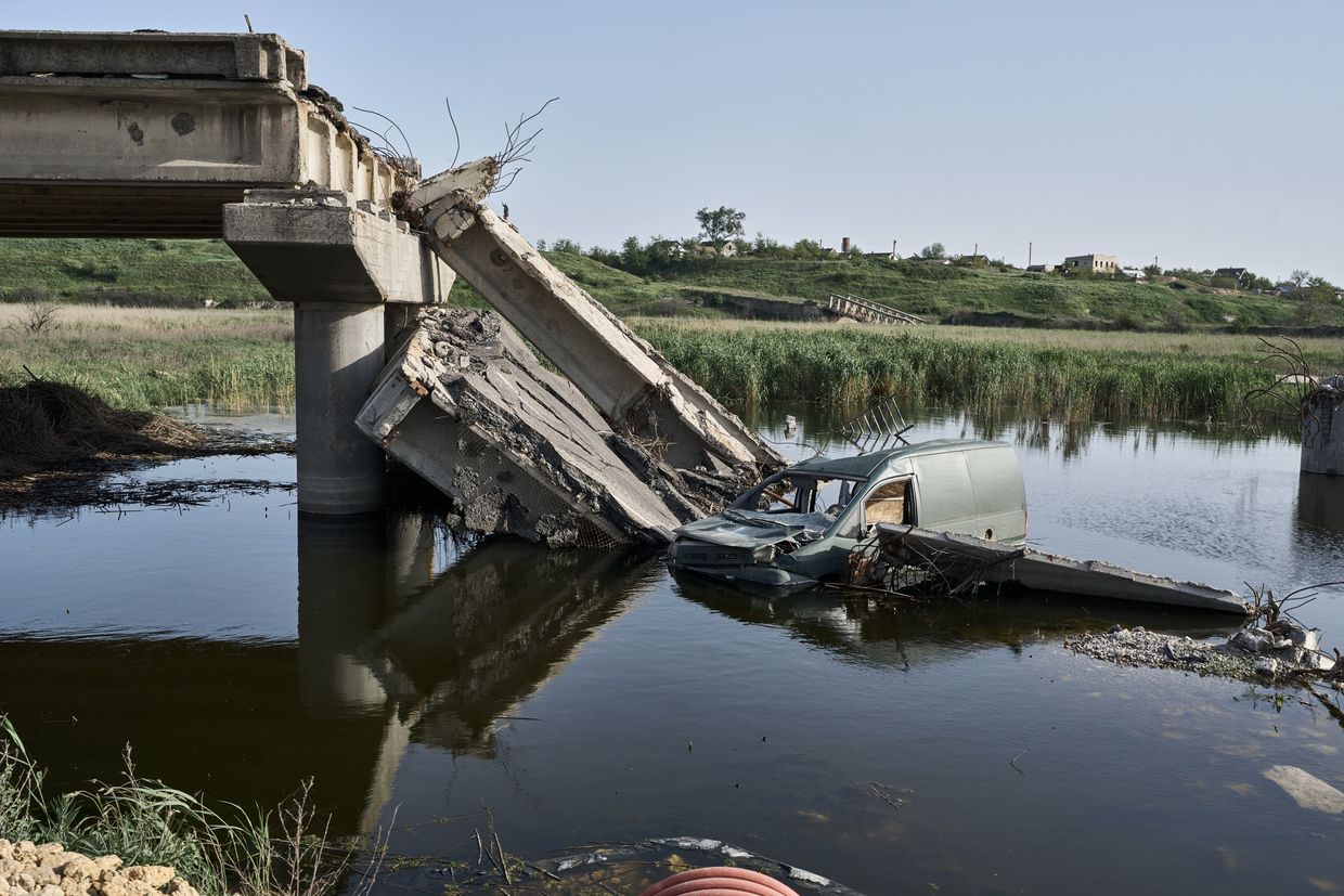 A destroyed bridge and a lowered car in the middle of the river in Kherson Oblast, Ukraine on April 27, 2024. 