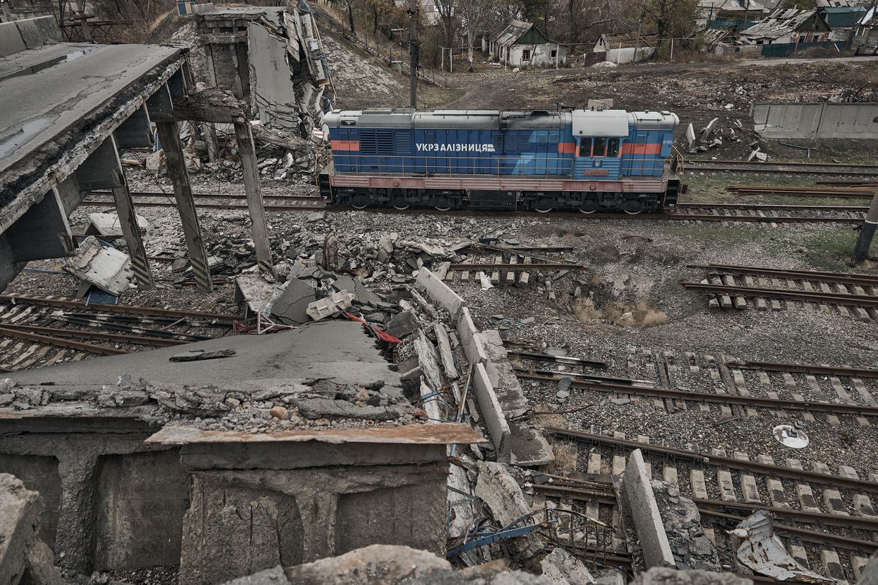 A locomotive passes under a destroyed bridge on a heavily damaged railway track in Pokrovsk, Ukraine, on Nov. 16, 2024. 