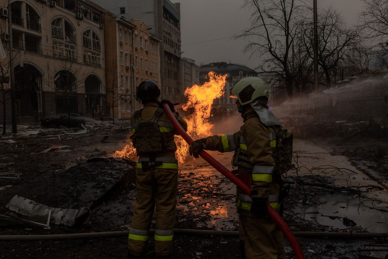 Ukrainian firefighters try to extinguish a fire on the site of a Russian missile attack in Kyiv, Ukraine, on Dec. 20, 2024