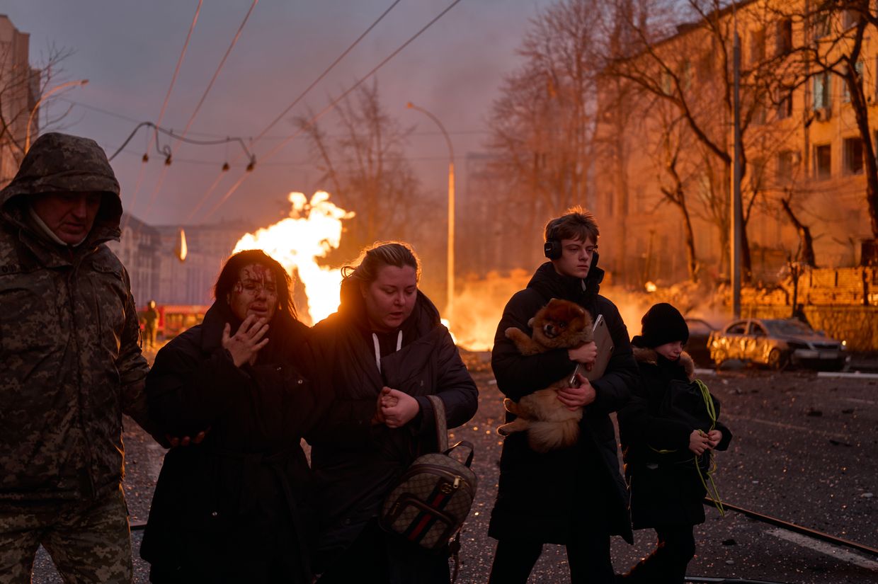 Civilians leave the site after a Russian ballistic missile hit the city center in Kyiv, Ukraine, on Dec. 20, 2024.