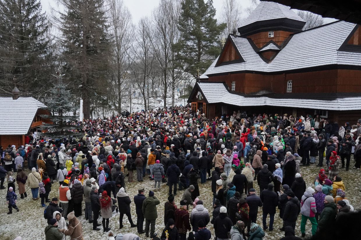 People gather for Christmas service in the church in Kryvorivnya village, Ivano-Frankivsk Oblast, Ukraine on Dec. 25, 2024. 