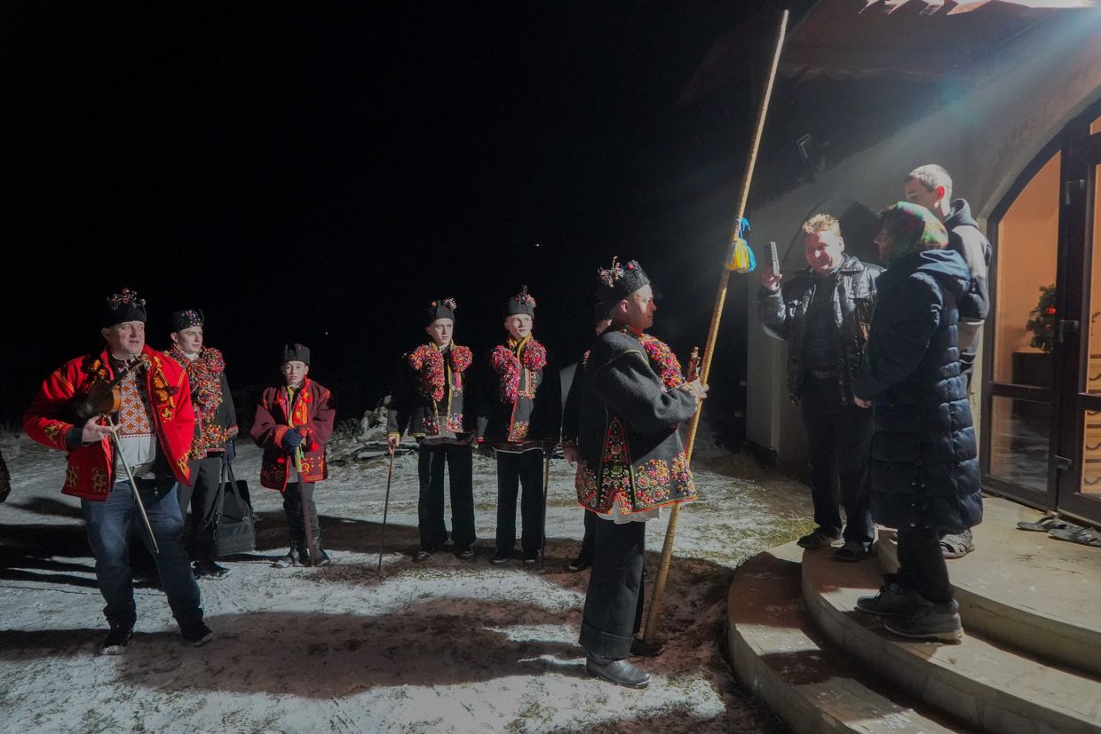 Carollers during Christmas Day koliada in Kryvorivnya village in Ivano-Frankivsk Oblast, Ukraine on Dec. 25, 2024.