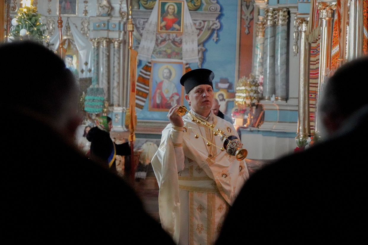 Father Vasyl Diychuk leads the Christmas Day service at a church in Sokolivka, Ivano-Frankivsk Oblast, Ukraine on Dec. 25, 2024.