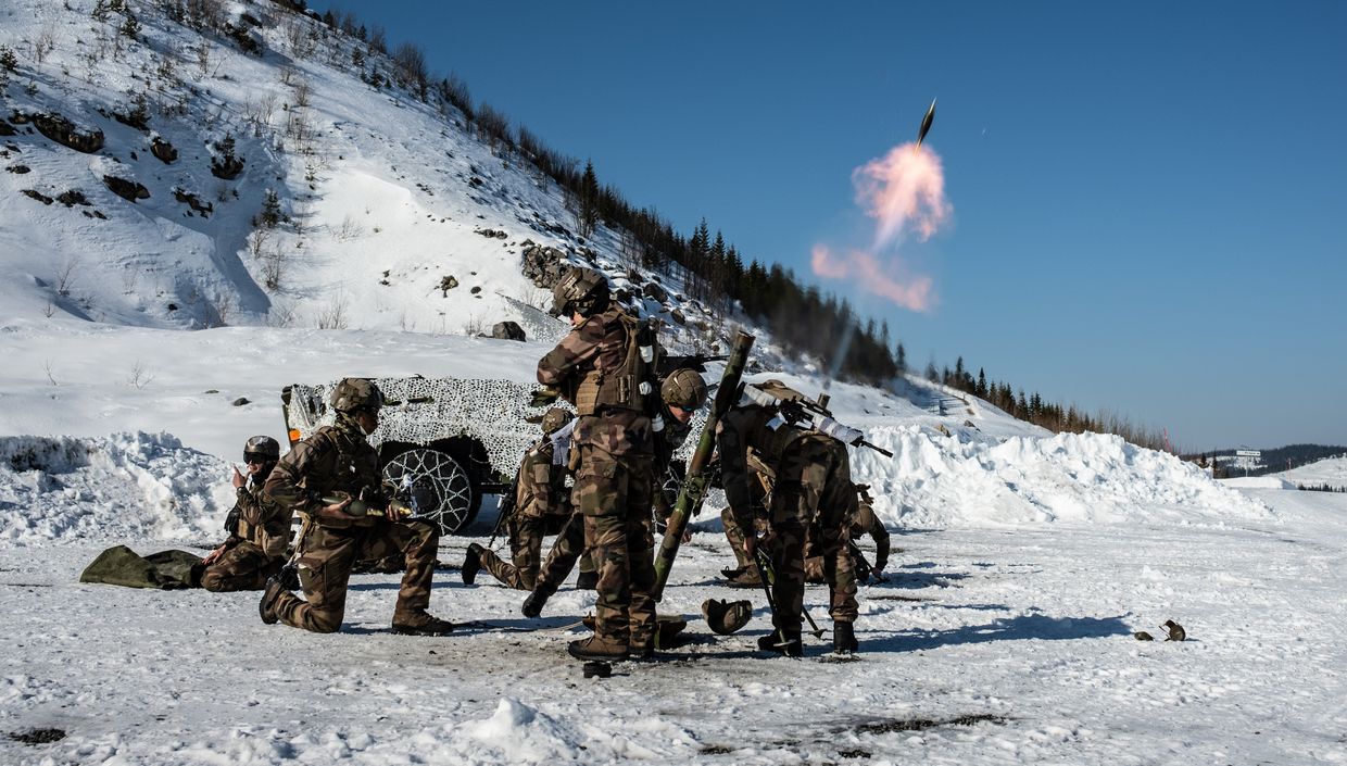 French soldiers of the 1st Infantry Regiment fire mortars near Rena, Norway, during Exercise Brilliant Jump 2022, March 17, 2022.