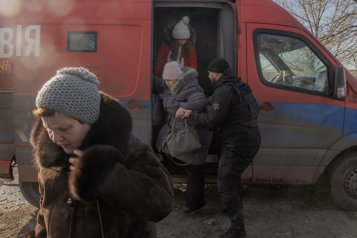 Evacuees from Pokrovsk arrive at an evacuation point outside the city in Donetsk Oblast, Ukraine, on Dec. 14, 2024, as Russian troops advance nearby. 