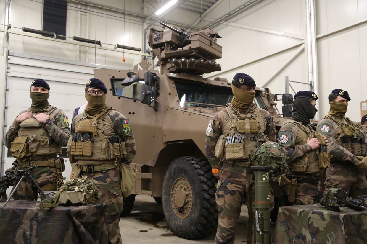  French NATO soldiers stand by a combat vehicle in a military hangar in Tapa, Estonia, on Dec. 17, 2024.