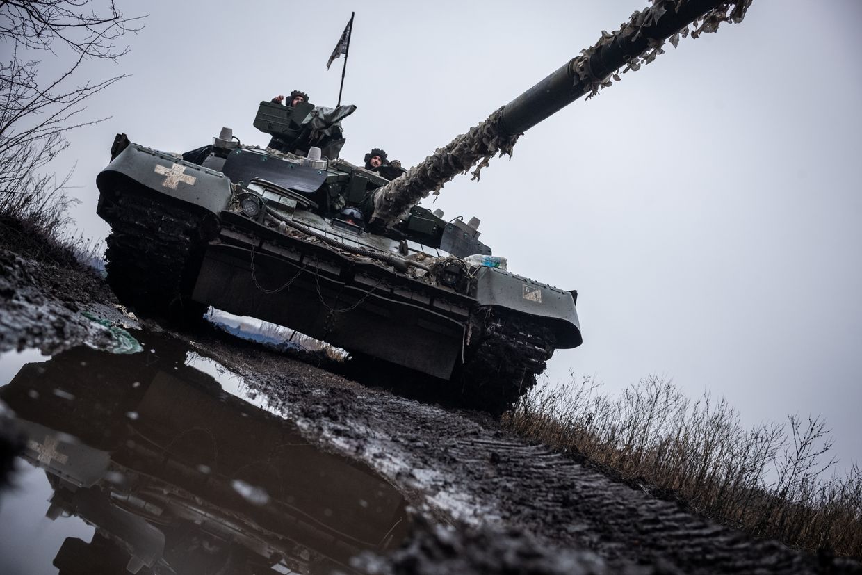  Ukrainian servicemen from the 93rd Brigade drive a tank to its position near Pokrovsk, Ukraine, on Dec. 23, 2024.