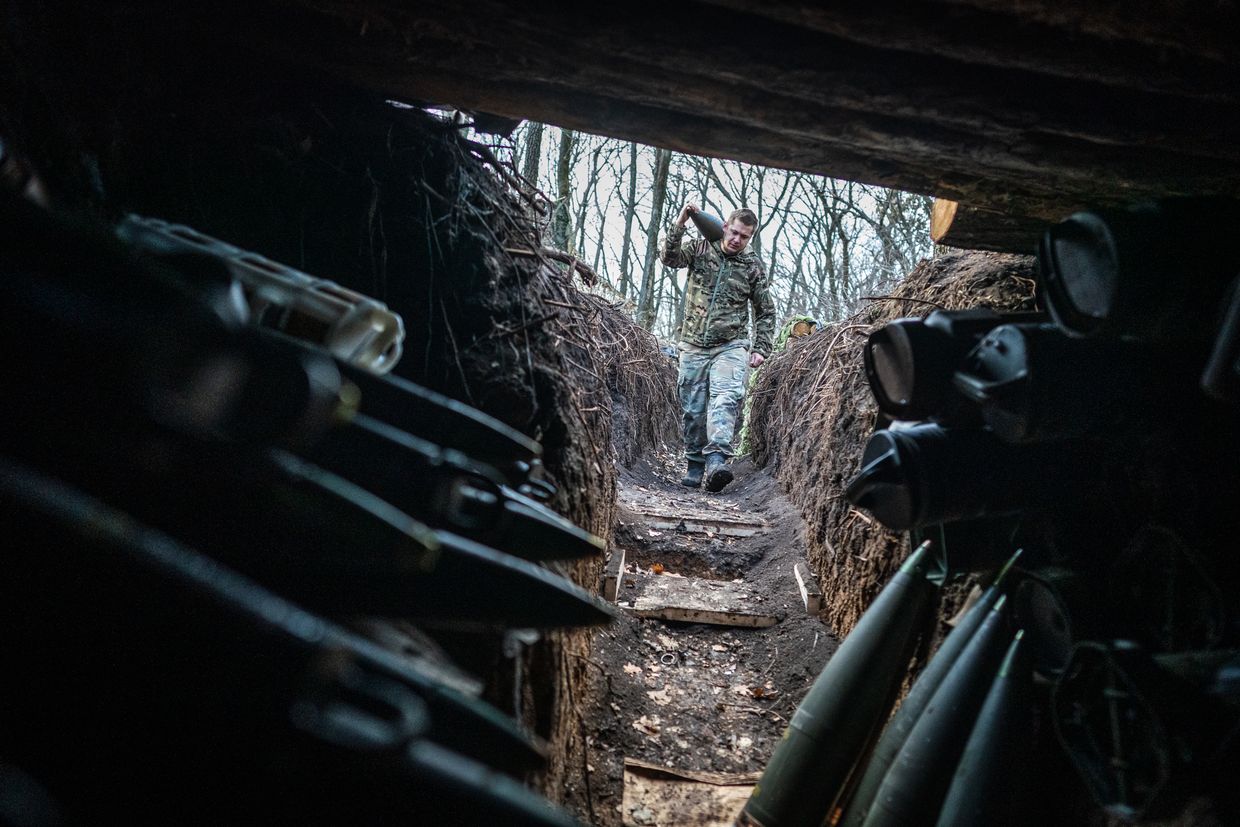 Ukrainian servicemen carry ammunition for a Polish-donated Krab mobile howitzer in the direction of Chasiv Yar, Donetsk Oblast, Ukraine, on Jan. 9, 2025.