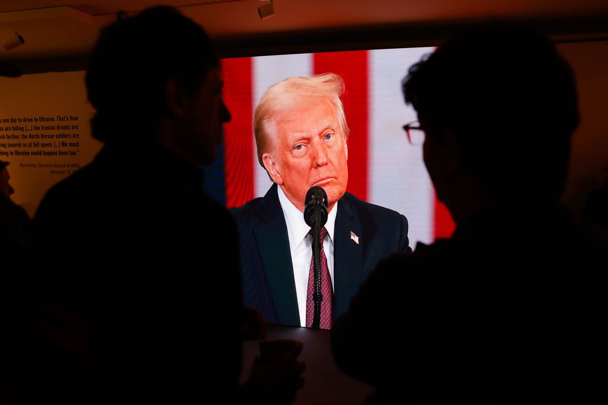 Visitors watch a broadcast of Donald Trump’s U.S. presidential inauguration at Ukraine House in Davos, Switzerland, on Jan. 20, 2025.