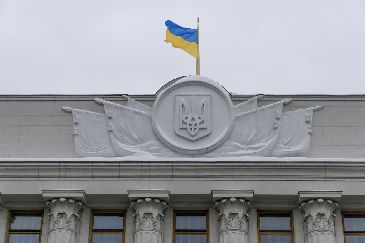 A Ukrainian flag flies above the headquarters of Ukraine's Finance Ministry in Kyiv, Ukraine, on Feb. 8, 2017. 