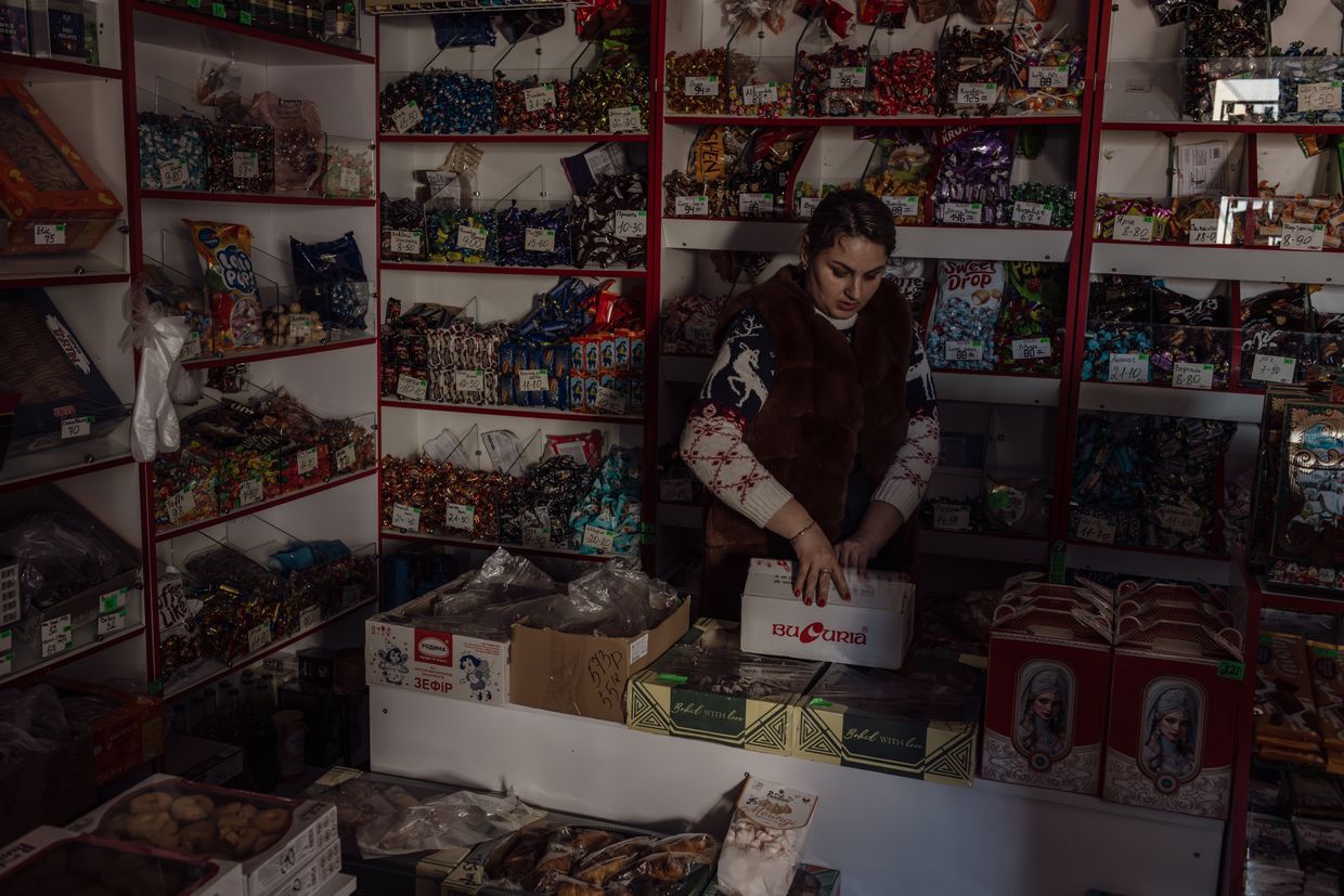 Zarina, at the shop where she works, which was without electricity, in Varniţa, Moldova on Jan. 8, 2025.