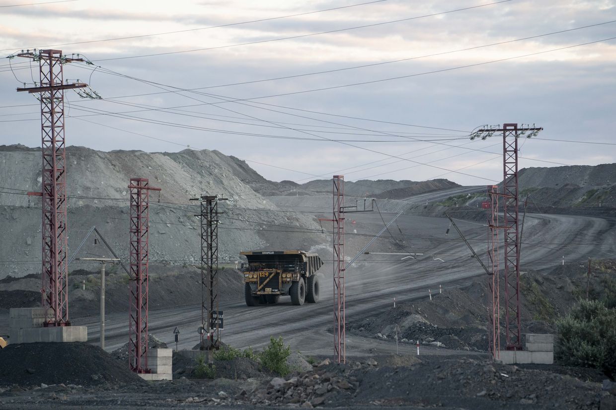 A dumper truck moves iron ore at a Ferrexpo excavation site near Horishni Plavni, Poltava Oblast, Ukraine, on July 11, 2019.