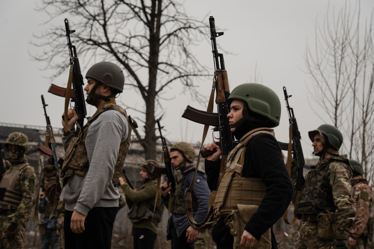 Trainees hold rifles during training by the third separate assault brigade in Kyiv, Ukraine, on March 15, 2024. 