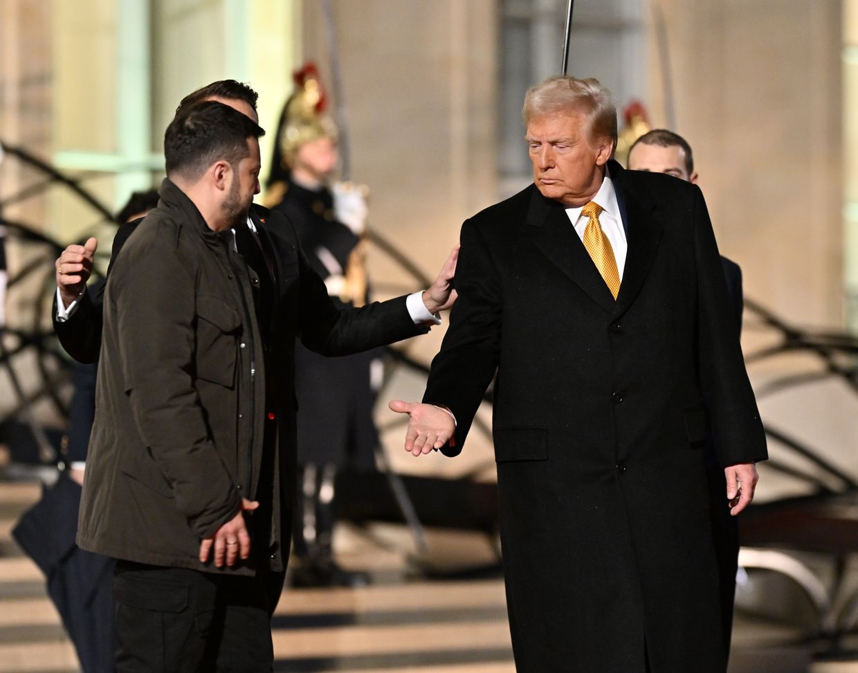 French President Emmanuel Macron, President-elect Donald Trump, and Ukraine's President Volodymyr Zelenskyy leave after a meeting at the Elysee Palace in Paris, France, on Dec. 7, 2024. 