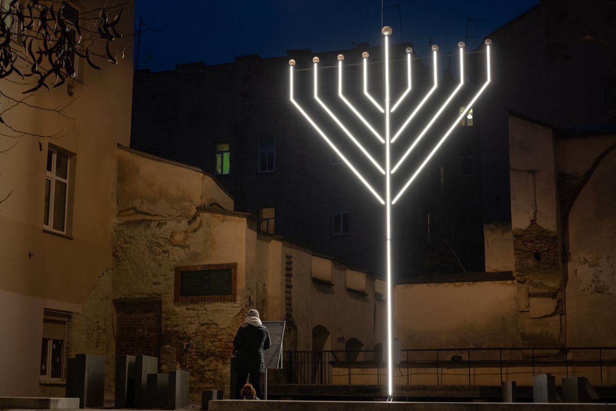 A Hanukkah menorah is lit on the eighth day at the former Golden Rose Synagogue site in Lviv, Ukraine, on Jan. 2, 2025. 