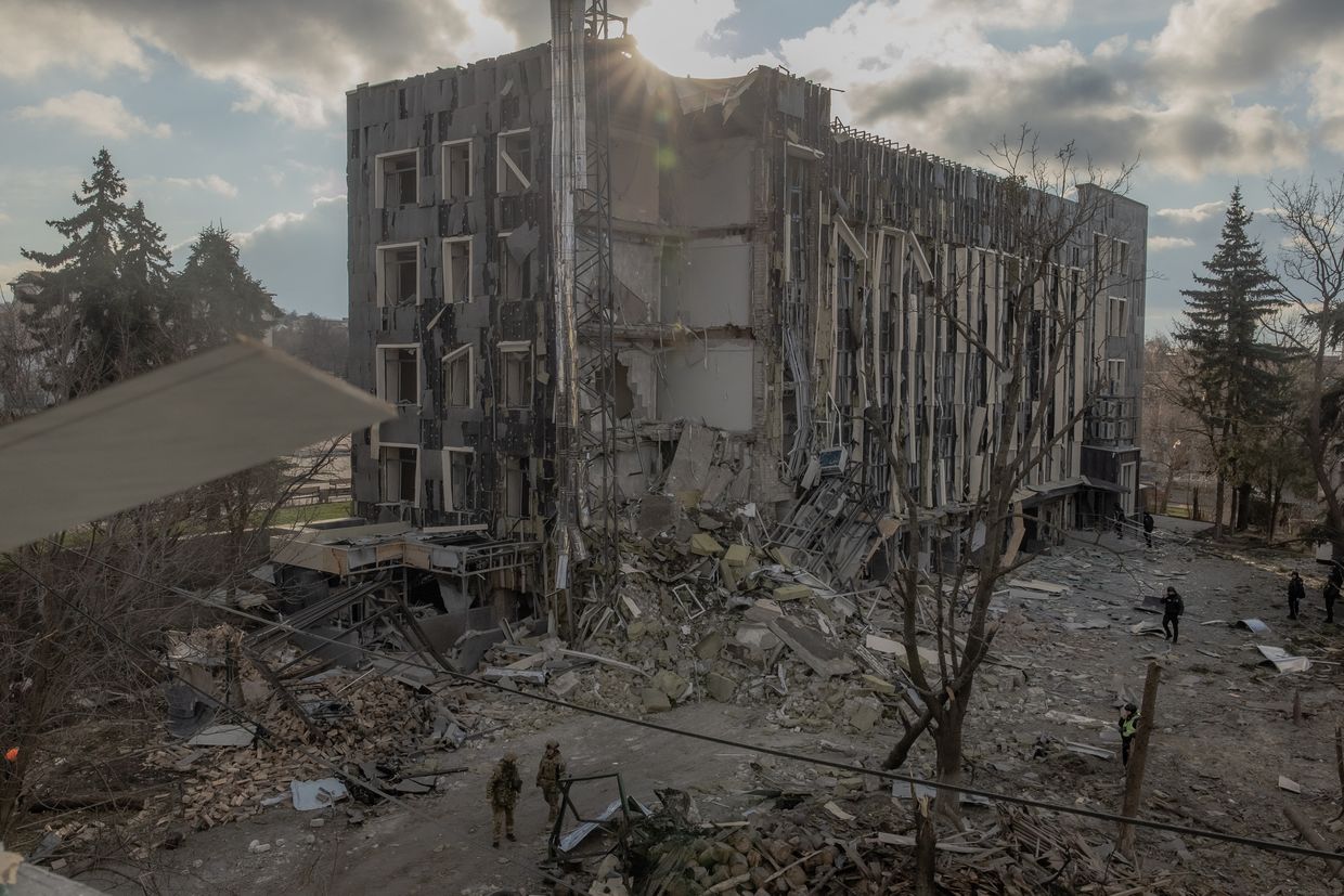 Ukrainian military members inspect a damaged building after a missile attack in Izyum, Kharkiv Oblast, Ukraine, on Feb. 4, 2025.