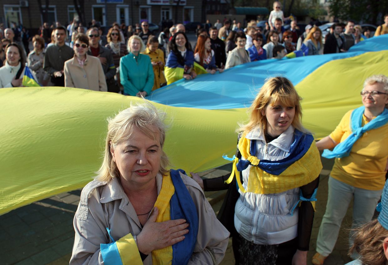 Mariupol locals sing the national anthem during a rally in Mariupol, Ukraine, on April 23, 2014. 