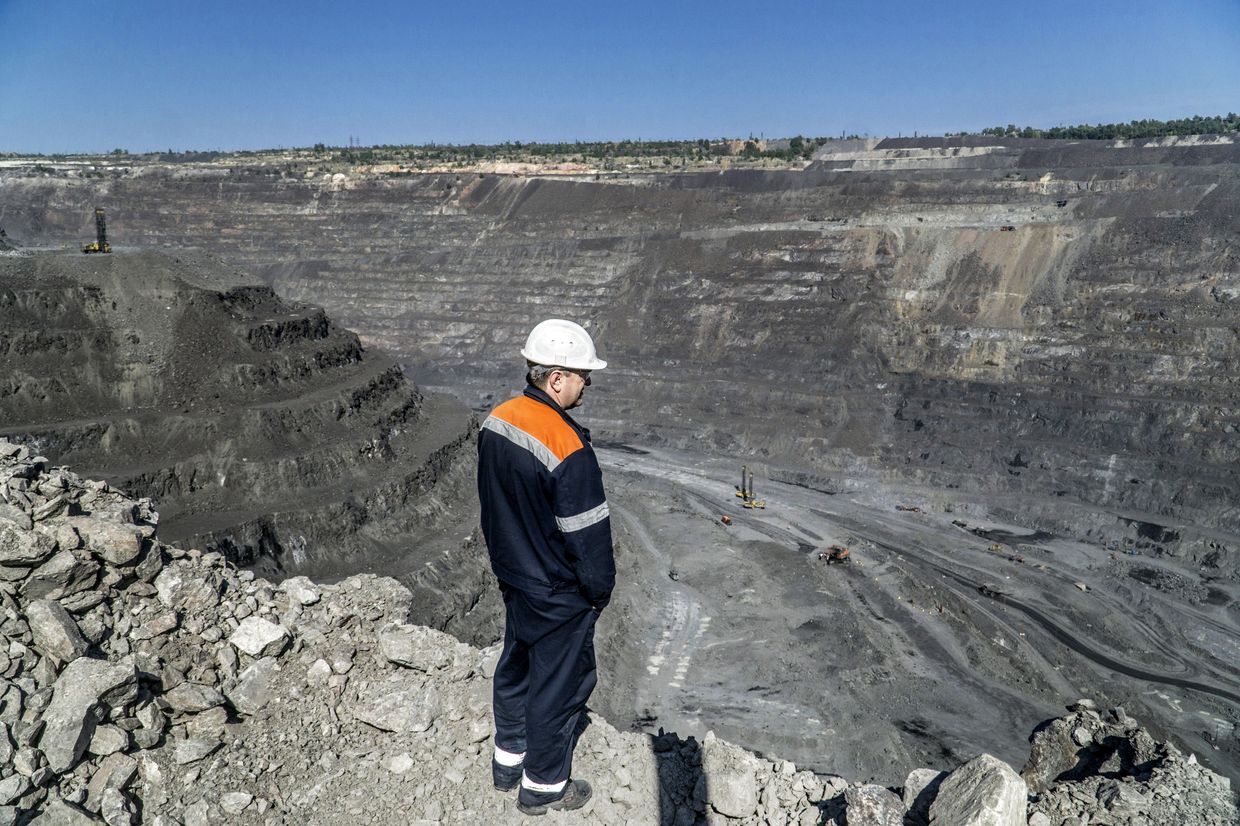 A worker surveys iron ore mining operations at the Yeristovo and Poltava iron ore mine in Poltava, Ukraine, on May 5, 2017.