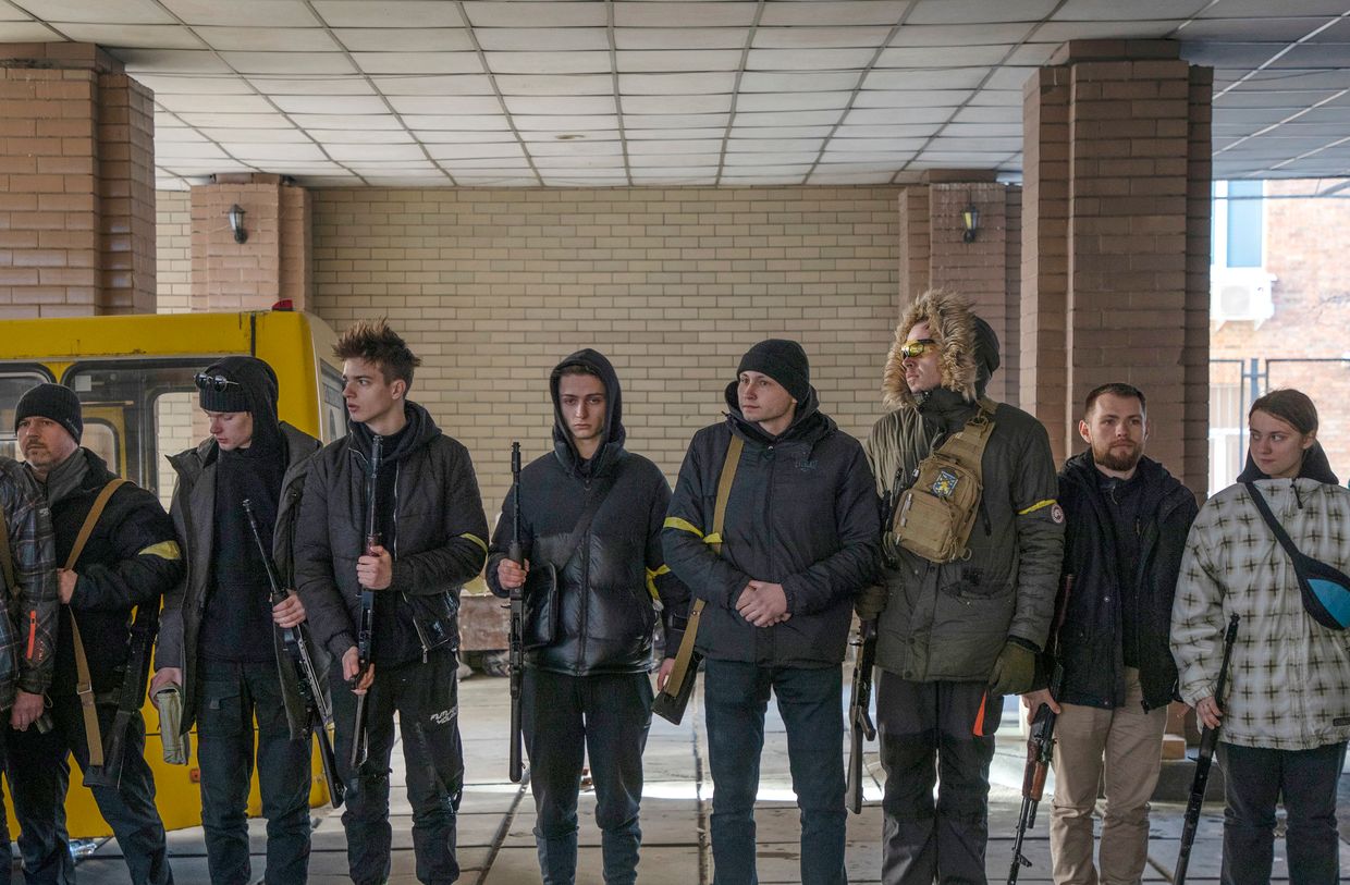 Young residents line up after enlisting in civil mobilization in Kyiv, Ukraine, on Feb. 28, 2022.