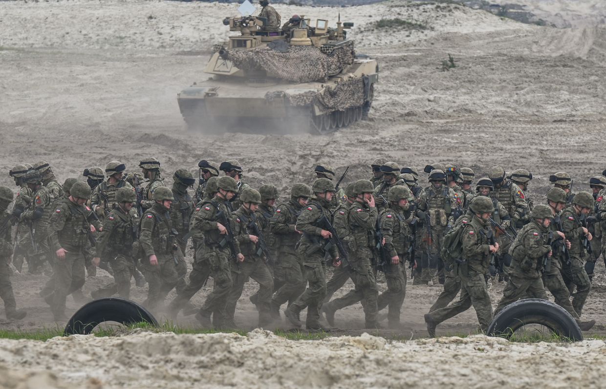 Polish soldiers train with M1A2 Abrams tanks during Anakonda-23 at the Nowa Deba range in Poland on May 6, 2023.