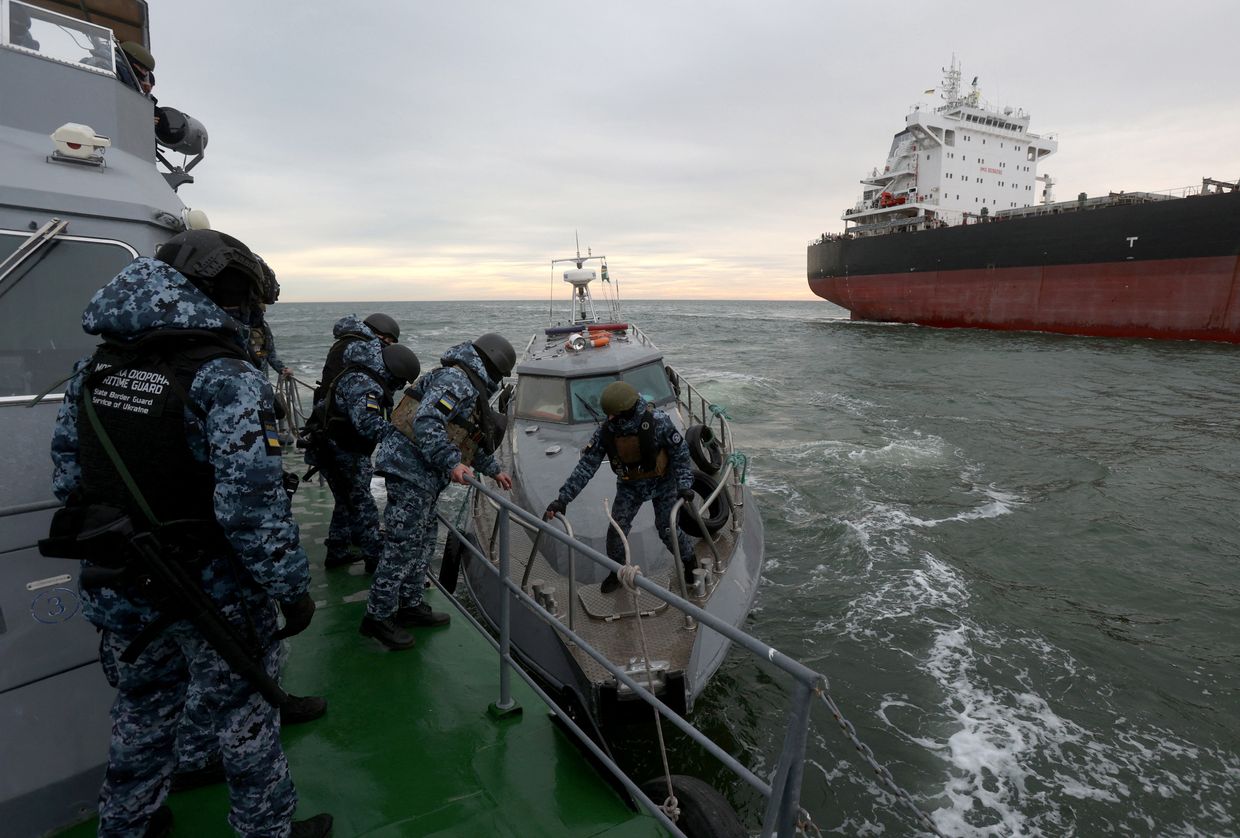 A Ukrainian Maritime Guard inspection group prepares to board a cargo ship in the northwestern Black Sea on Dec. 18, 2023, amid the Russian invasion. 