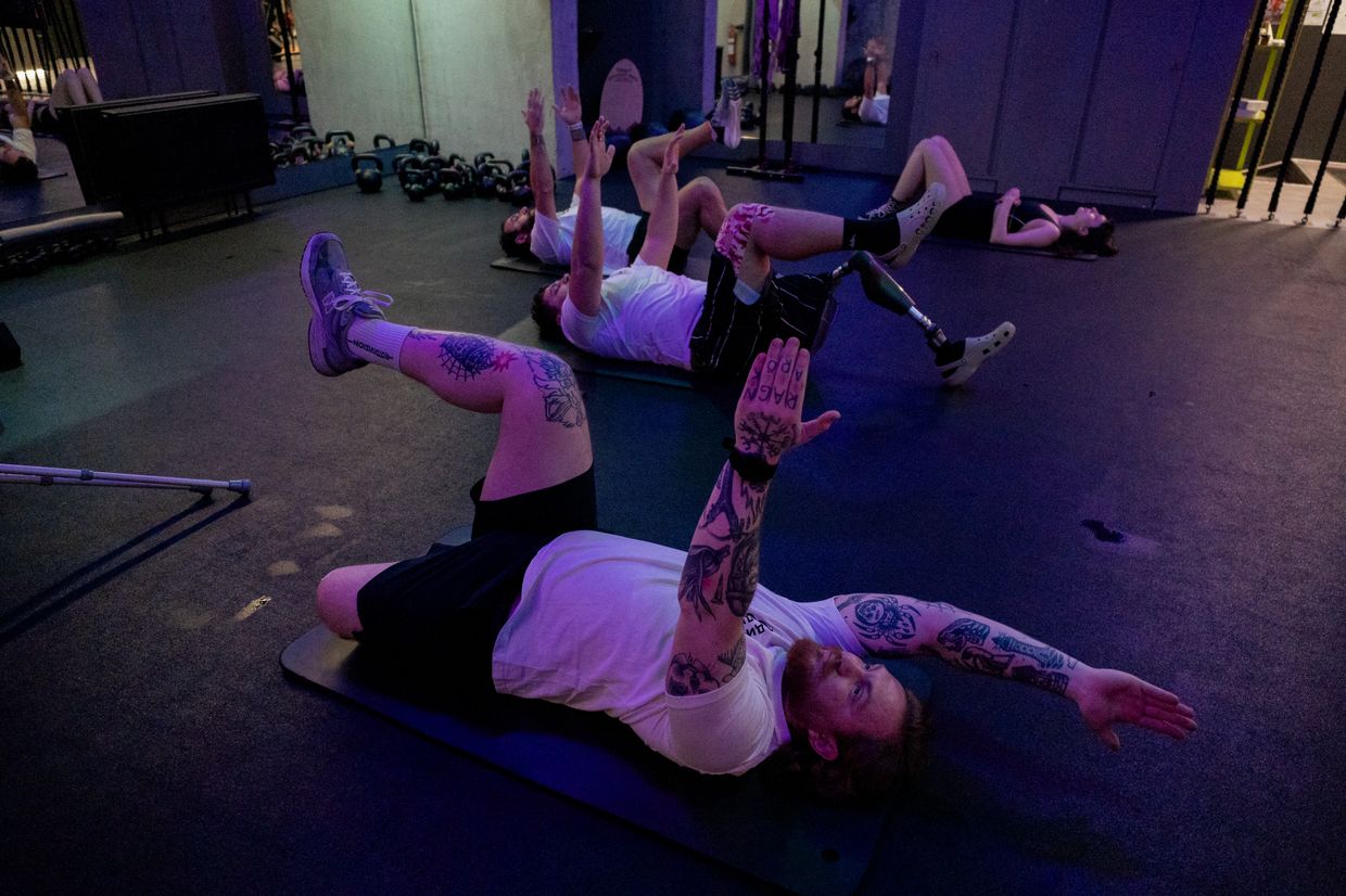 Blind veterans learn orientation on unfamiliar streets during rehabilitation in Lviv Oblast, Ukraine, on March 29, 2024.Ukrainian military veterans work out in a gym in Kyiv, Ukraine, on Jan. 13, 2025, amid the Russian invasion of Ukraine.