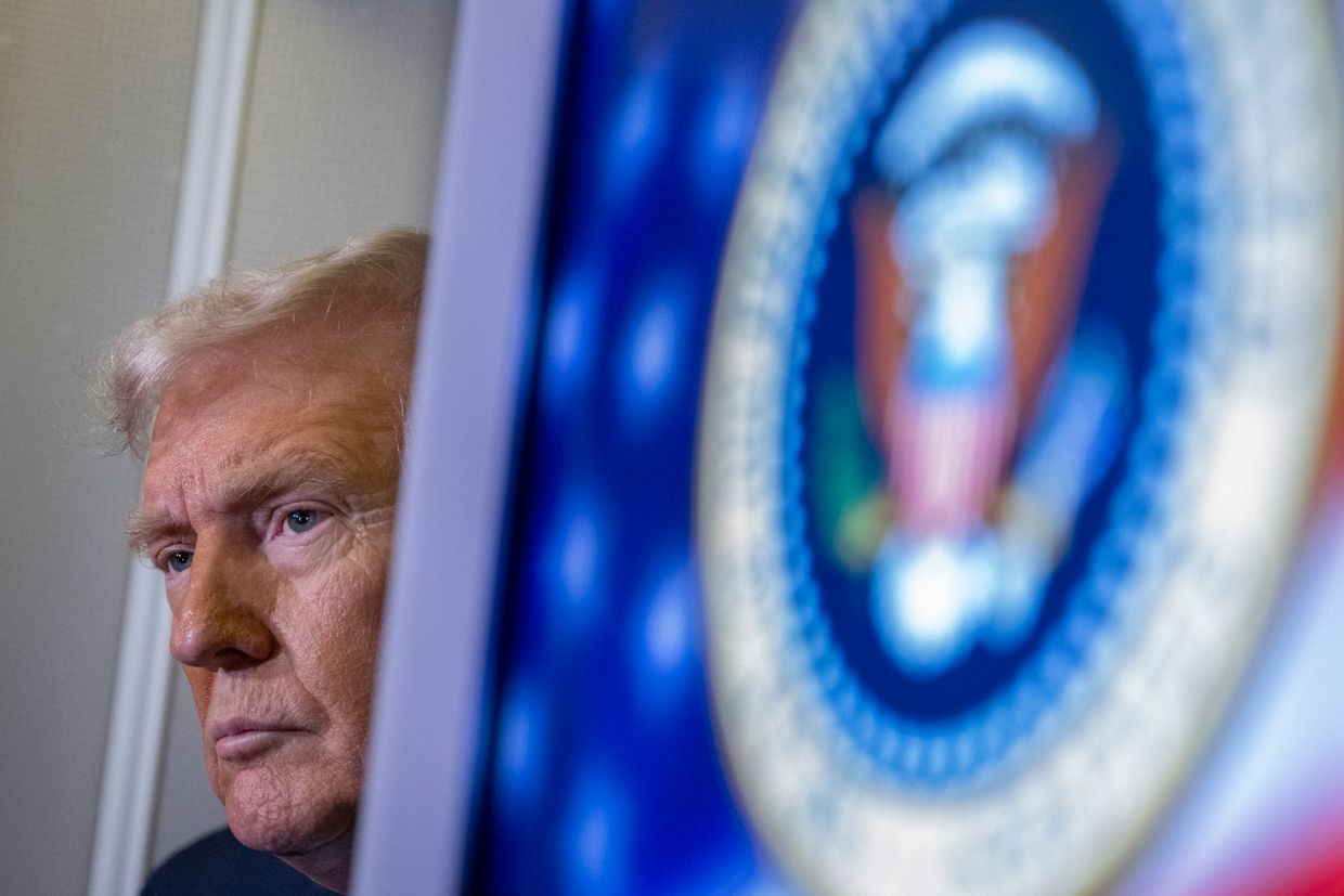 U.S. President Donald Trump speaks to journalists aboard Air Force One while traveling from West Palm Beach to Washington, U.S. on March 9, 2025. 