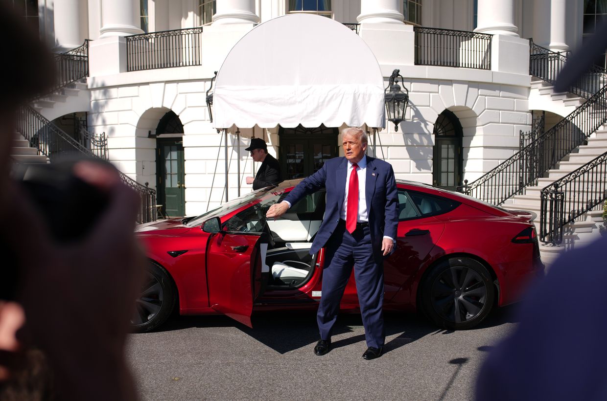 U.S. President Donald Trump exits a Tesla Model S on the South Lawn of the White House in Washington, DC, on March 11, 2025. 