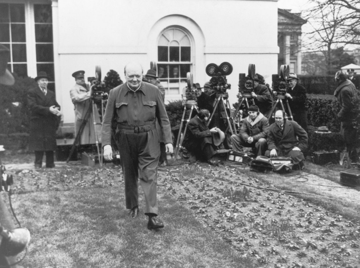 Then-British Prime Minister Winston Churchill poses for cameras in the White House, wearing his 'siren suit', on Jan. 17, 1942. 