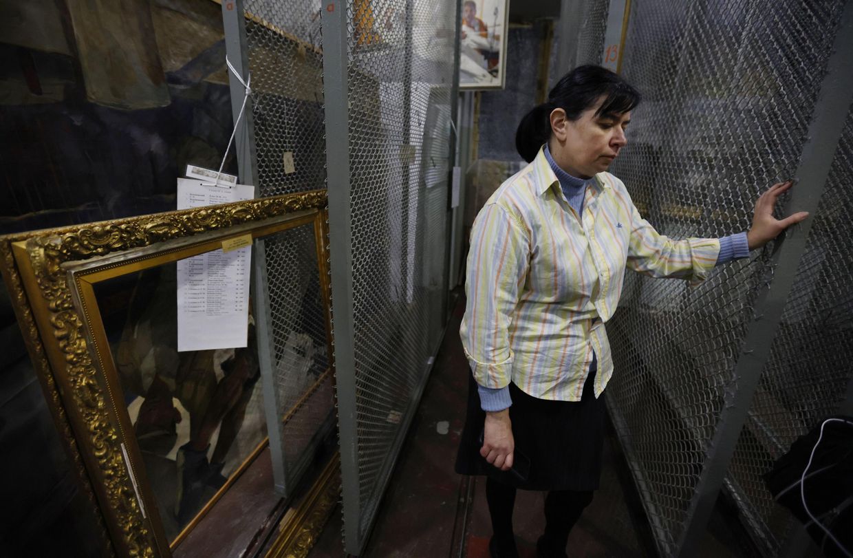 Museum staffer in empty storage room after Russian plunder in Kherson, Ukraine, on Dec. 8, 2022.