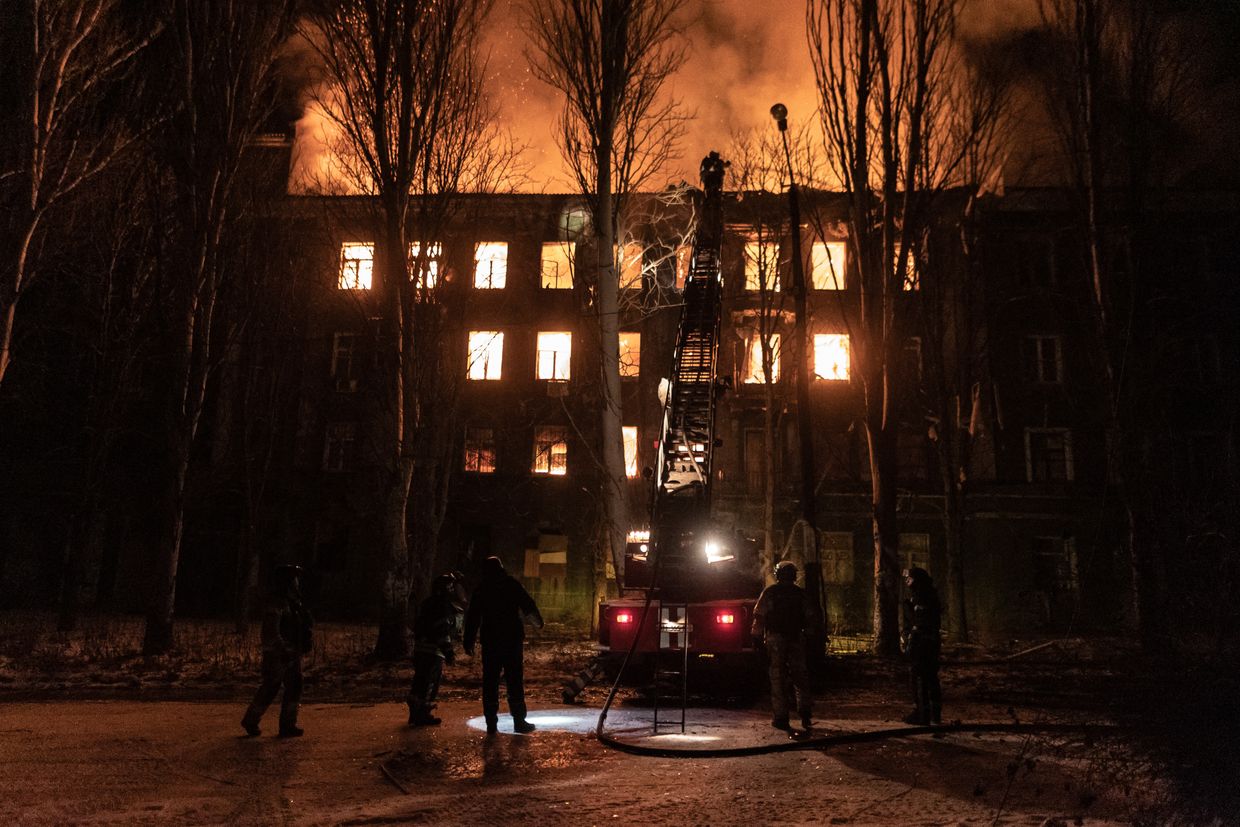 Emergency service workers extinguish a fire in a residential building after Russian shelling in Kostiantynivka, Ukraine, on Feb. 26, 2025.