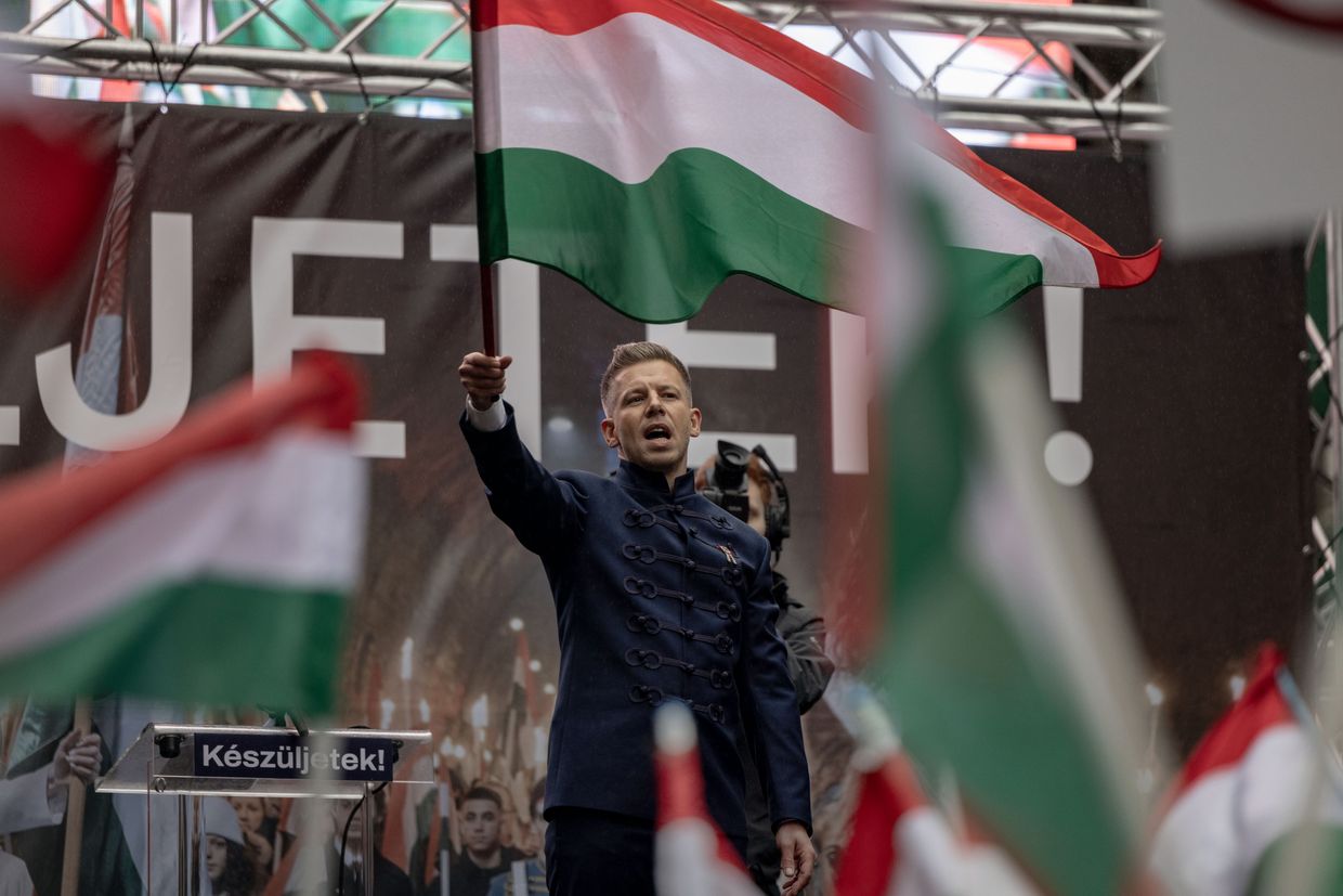 Peter Magyar holds a Hungarian flag during a protest in Budapest, Hungary, on March 15, 2025.