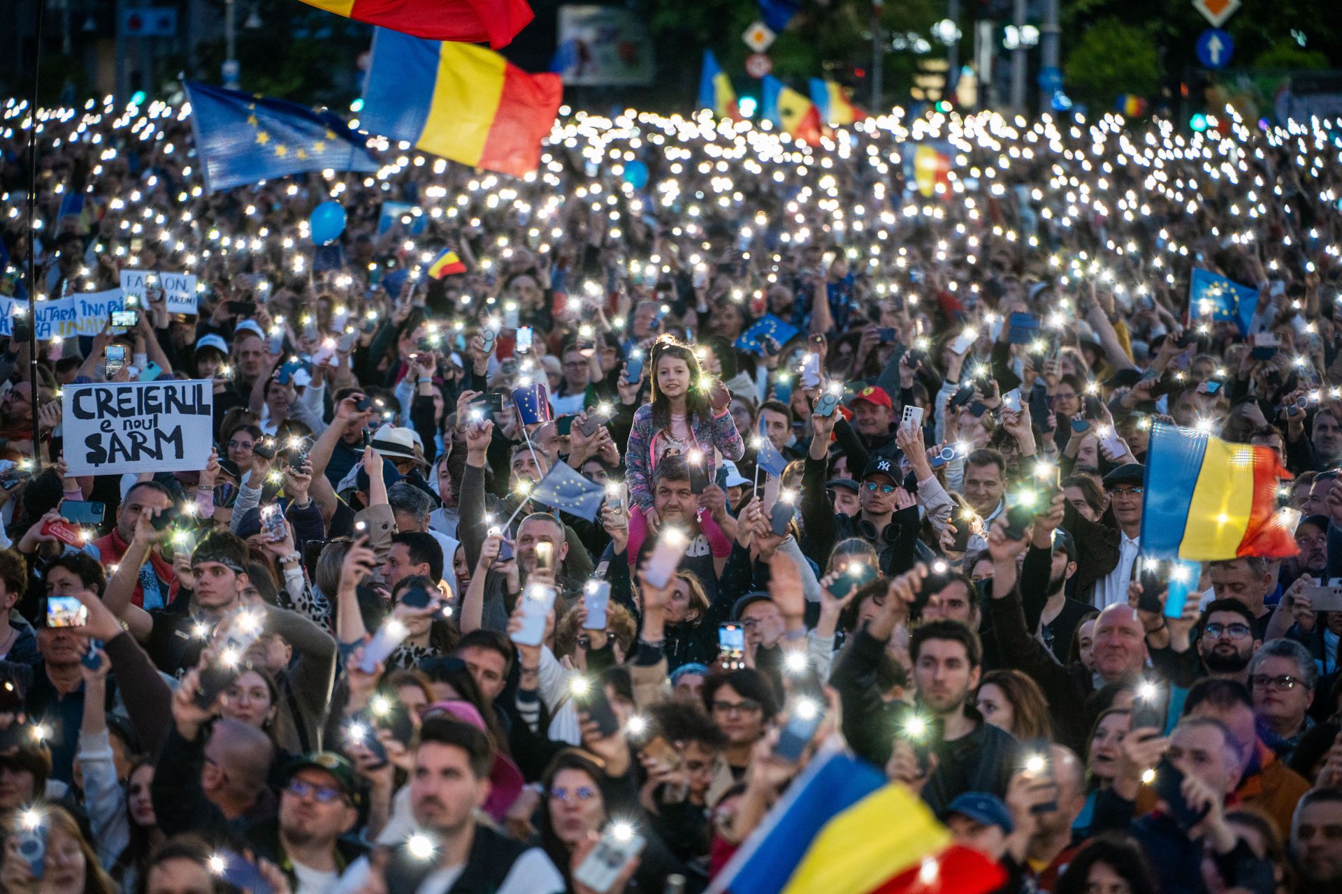 Supporters of Romanian presidential candidate Nicușor Dan attend an electoral rally in Bucharest, Romania, on May 11, 2025.