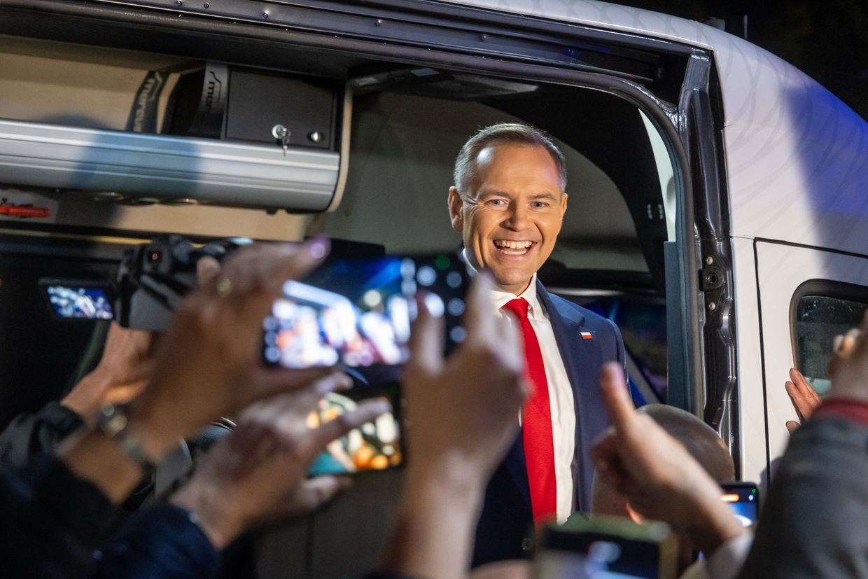 Karol Nawrocki, presidential candidate backed by Poland’s Law and Justice party, greets supporters in Warsaw after a debate on May 12, 2025.