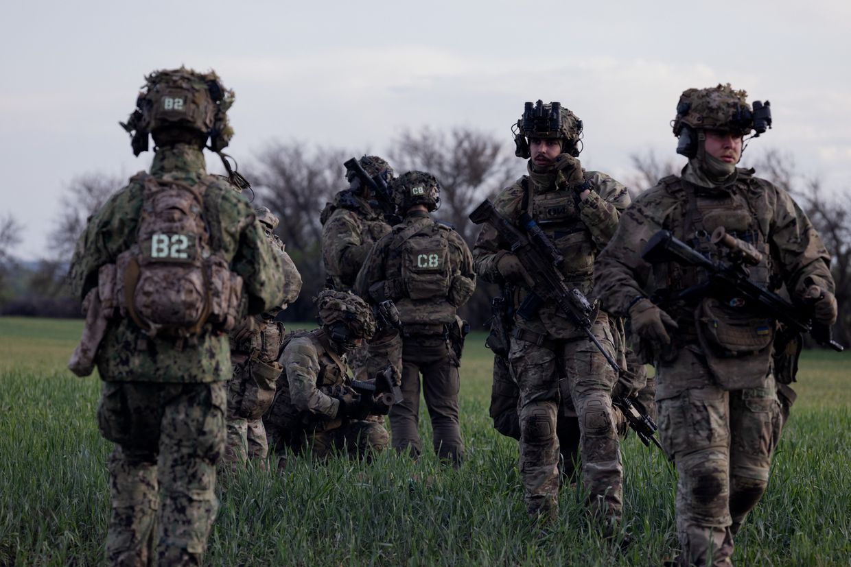 Ukrainian servicemen of the 3rd Separate Assault Brigade take part in military training at an undisclosed location in Kharkiv Oblast, Ukraine, on May 14, 2025.