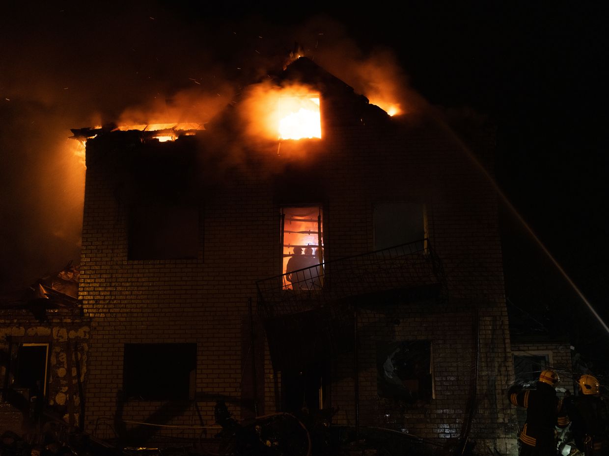 Firefighters extinguish a blaze at a private home in Kharkiv’s Saltivka district after a massive Russian drone attack on April 29, 2025.