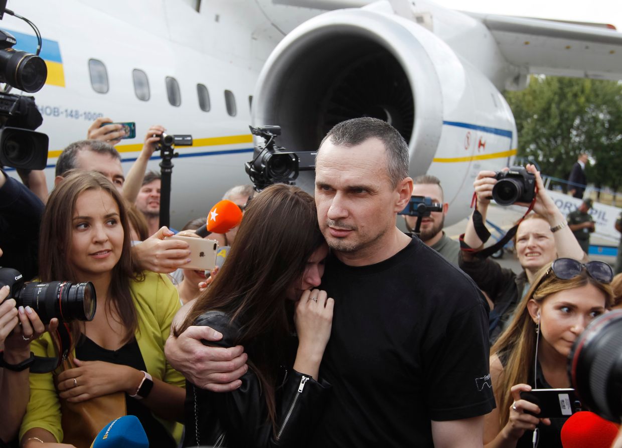 A Ukrainian serviceman, released from Russian captivity during the second phase of the “1,000-for-1,000” prisoner exchange, hugs his loved one in Chernihiv Oblast, Ukraine, on May 24, 2025Ukrainian film director Oleg Sentsov (C) hugs his daughter Alina Sentsova after landing at Boryspil International Airport near Kyiv, Ukraine, on Sept. 7, 2019.