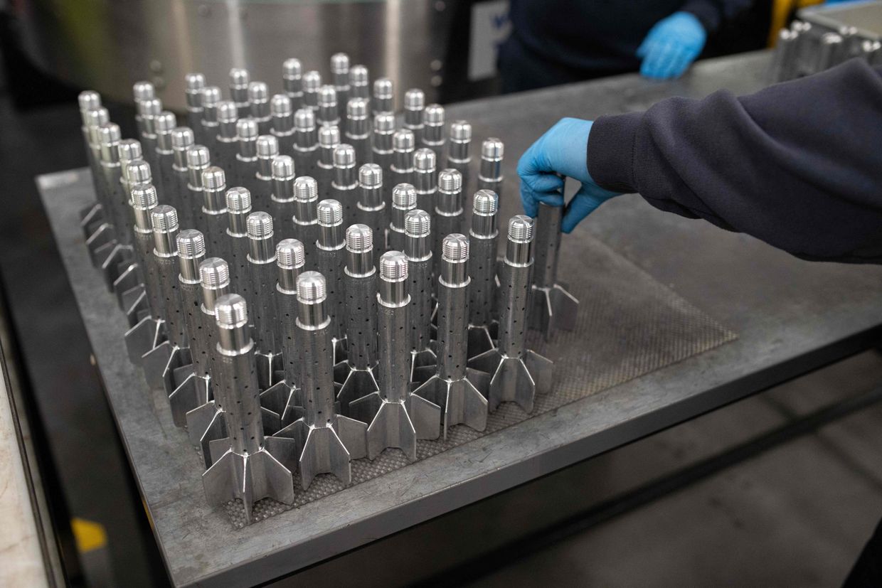 A BAE Systems employee works on the tail section of 81mm High Explosive Mortar munitions in Washington, United Kingdom, on Nov. 8, 2023.