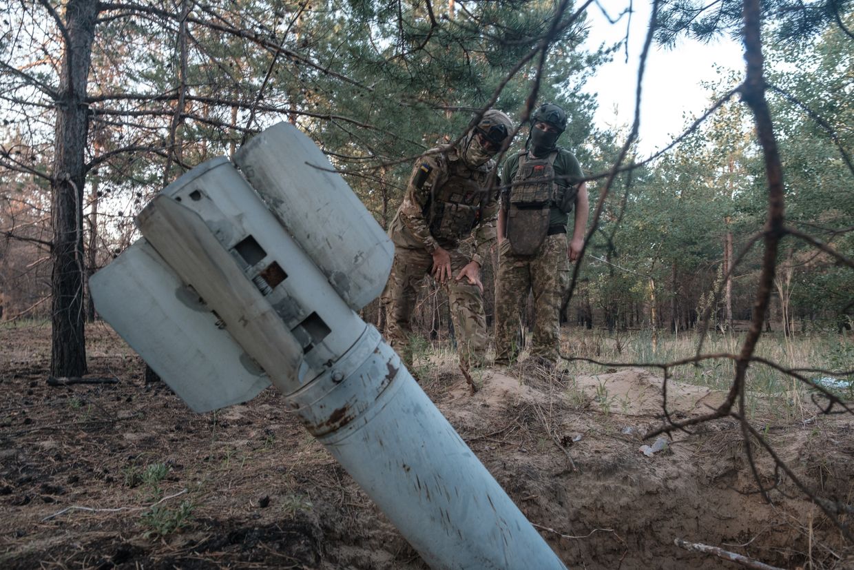 Ukrainian National Guard soldiers examine a Russian rocket that crashed but did not explode in Serebryansky forest in Donetsk Oblast, Ukraine, on June 26, 2024. 