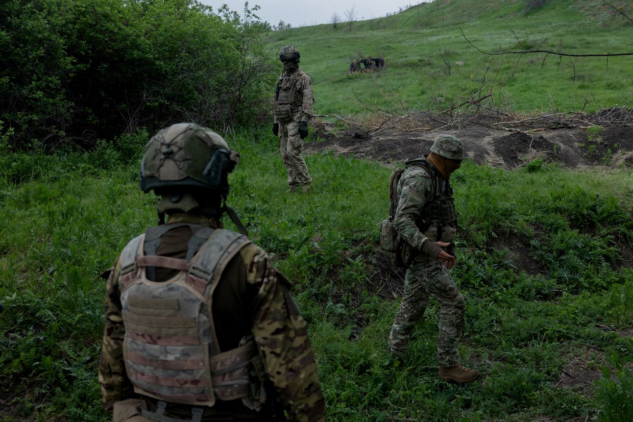 Ukrainian military instructors of the 24th Separate Assault Battalion “Aidar” walk at an undisclosed location in Dnipropetrovsk Oblast, Ukraine, on May 9, 2025.