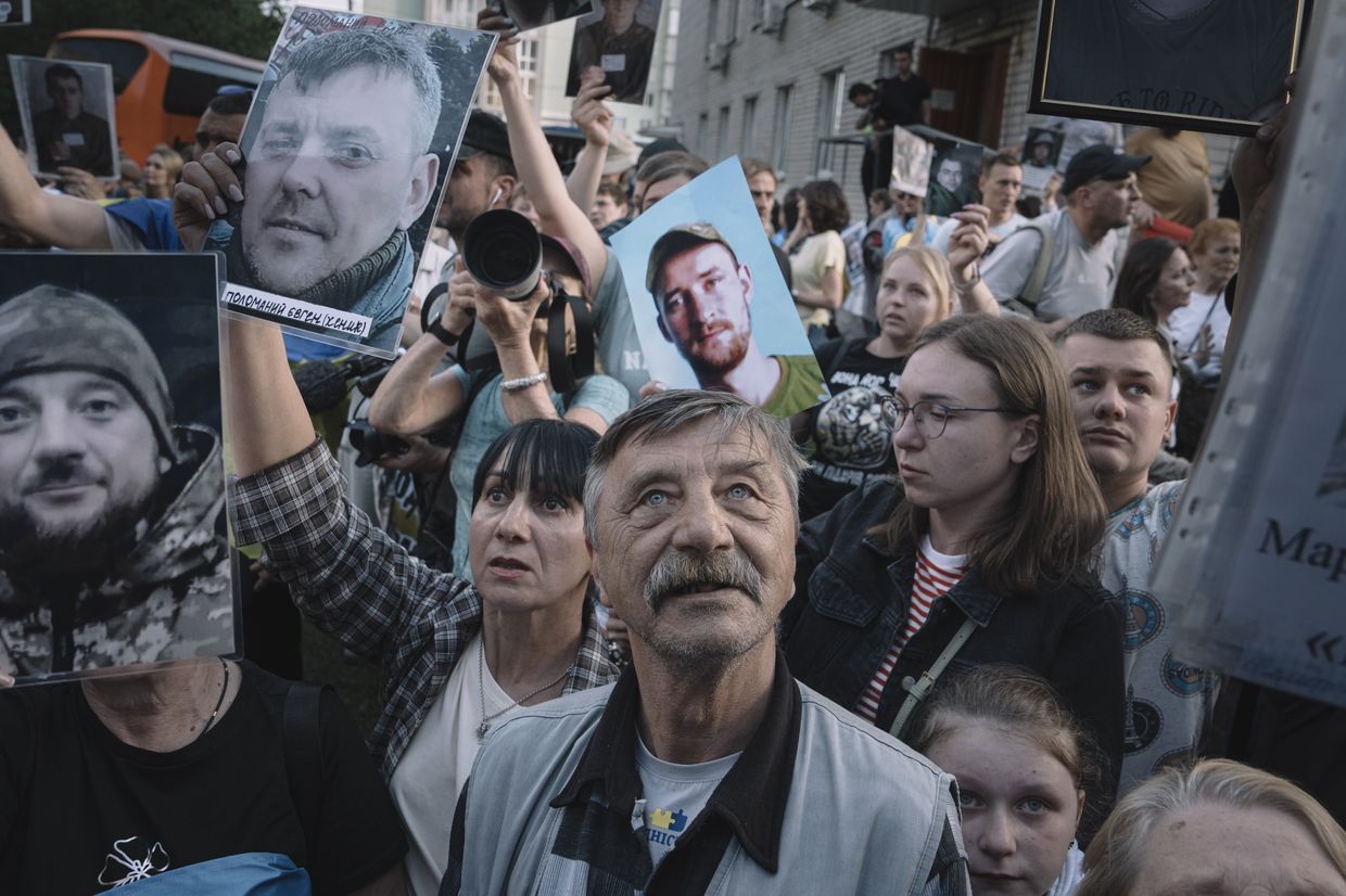Relatives and military personnel welcome Ukrainian servicemen following a major prisoner-of-war swap with Russia at an undisclosed location in Ukraine, on May 23, 2025.
