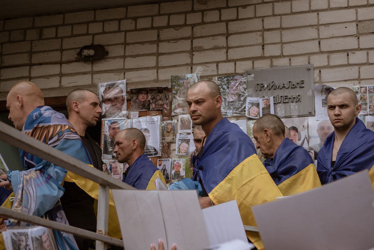 Recently released Ukrainian prisoners of war are seen after being freed during the “1,000-for-1,000” prisoner swap between Ukraine and Russia, in northern Ukraine, on May 25, 2025.