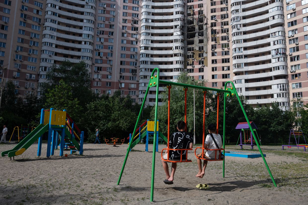 Children play near a residential building damaged by a Russian attack in Kyiv, Ukraine, on June 17, 2025. Children play near a residential building damaged by a Russian attack in Kyiv, Ukraine, on June 17, 2025.