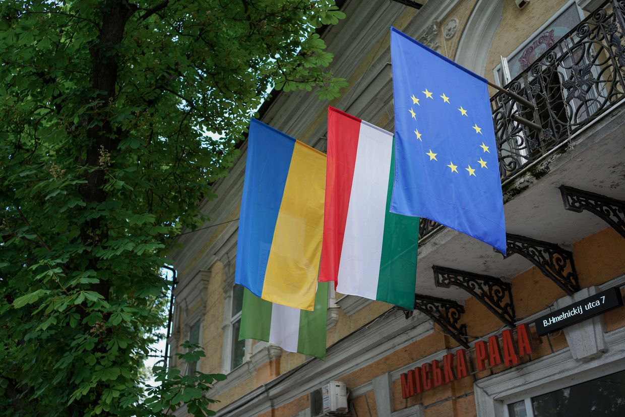 Ukrainian, Hungarian and EU flags on the town hall in Berehove, Zakarpattia Oblast, Ukraine on May 22, 2025