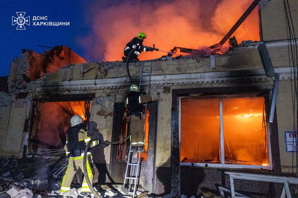 Firefighters put out a fire in a destroyed building overnight on June 12, 2025 following a Russian drone attack.