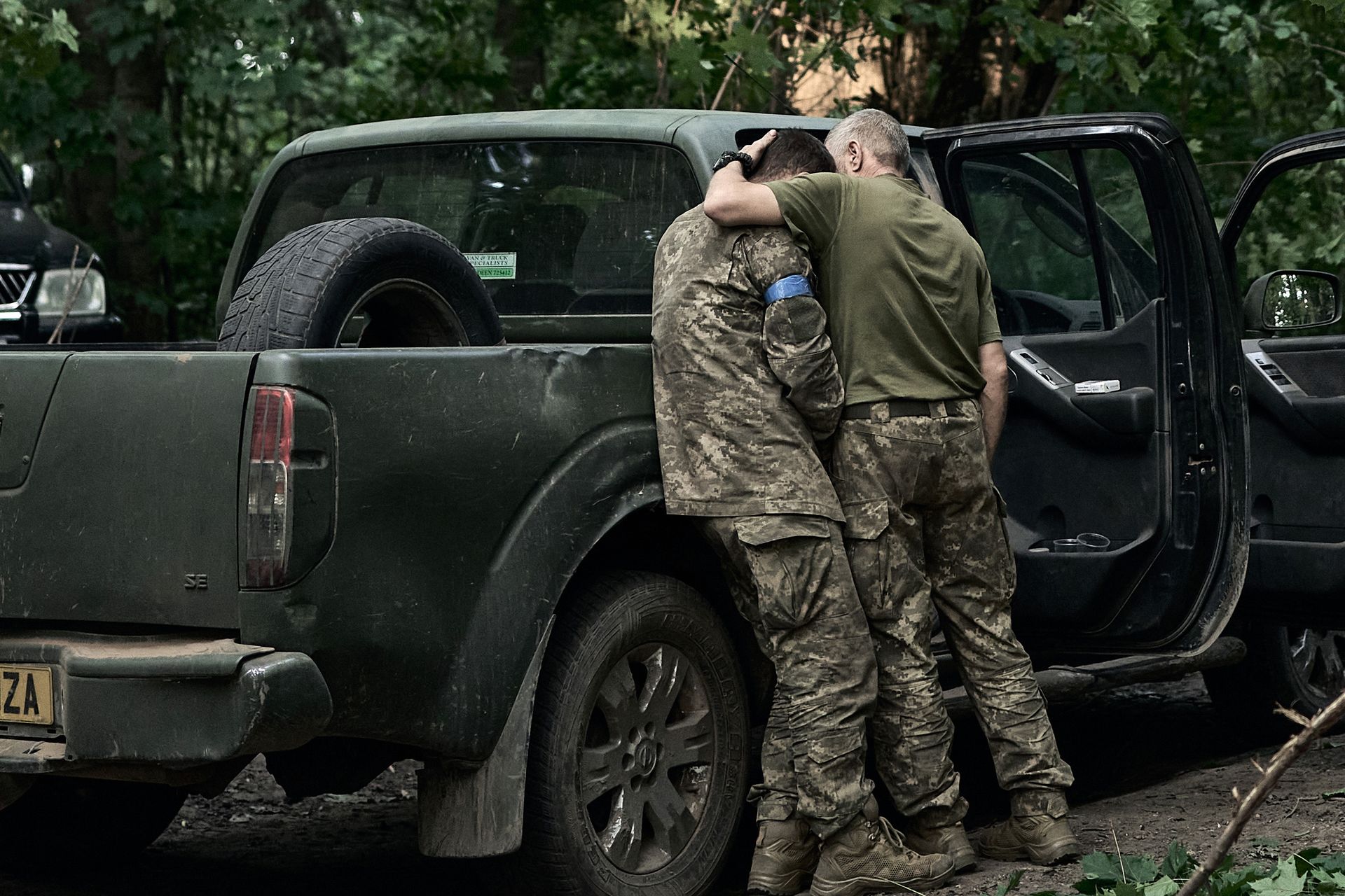 A Ukrainian soldier cries on his comrade’s shoulder after returning from the Kursk region near the Russian border in Sumy Oblast, Ukraine, on Aug. 14, 2024. 