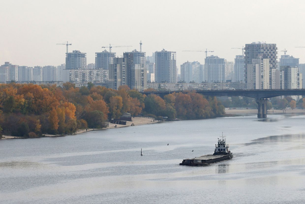 A cargo ship sails on the Dnipro River on a warm sunny day in Kyiv, Ukraine, on Oct. 28, 2024, amid the Russian invasion.