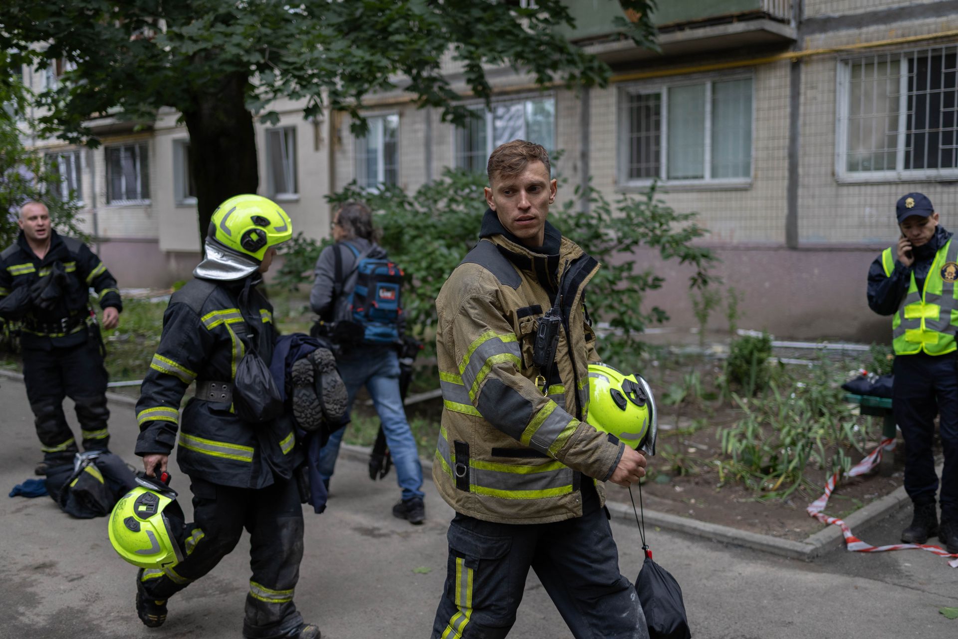 State Emergency Service workers near damaged house due to Russian overnight attack in Kyiv, Ukraine on July 31, 2025.